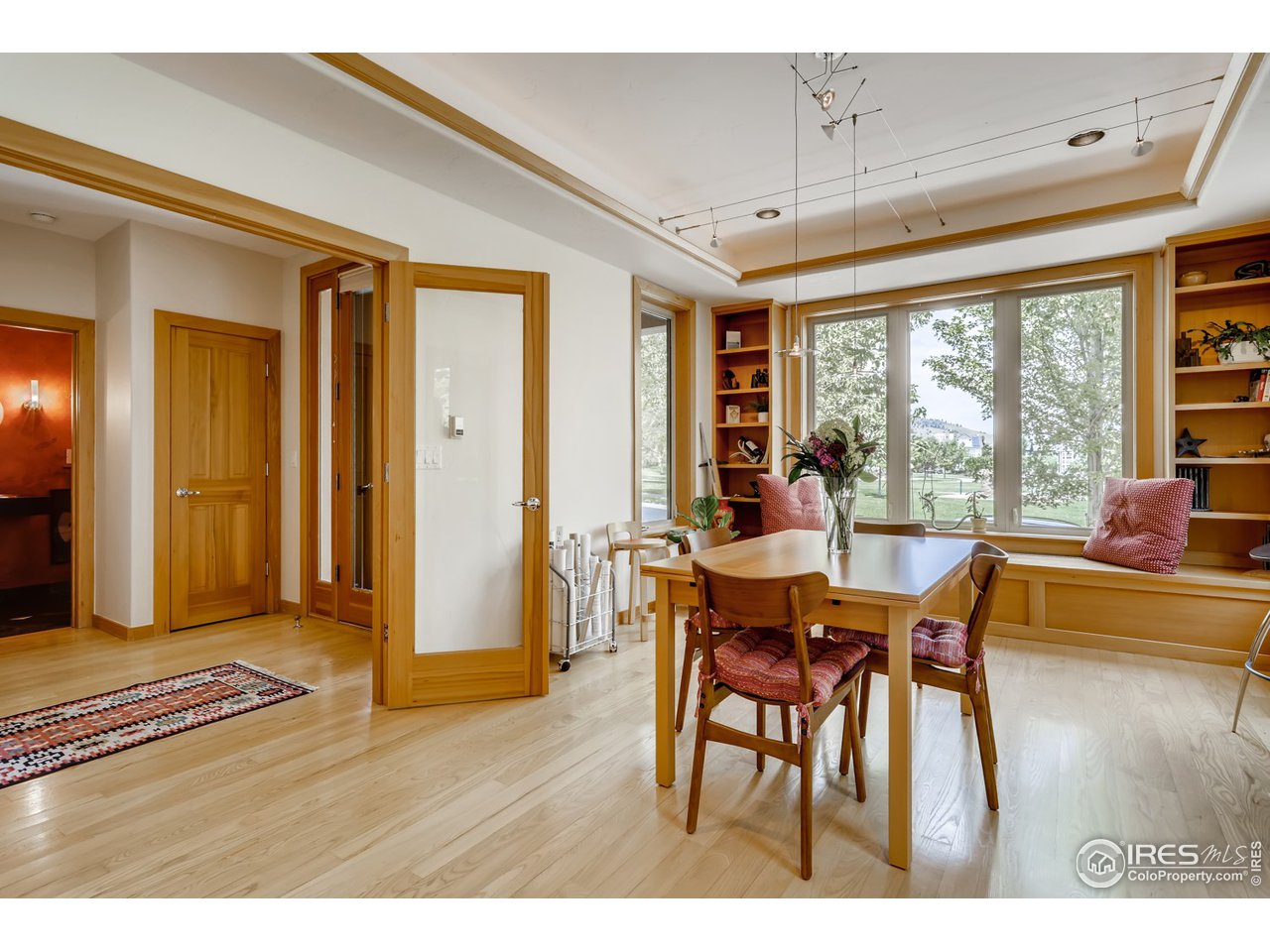 566 Dakota Boulevard Boulder, CO 80304 - Photo 8 of 24 a dining room with furniture and wooden floor