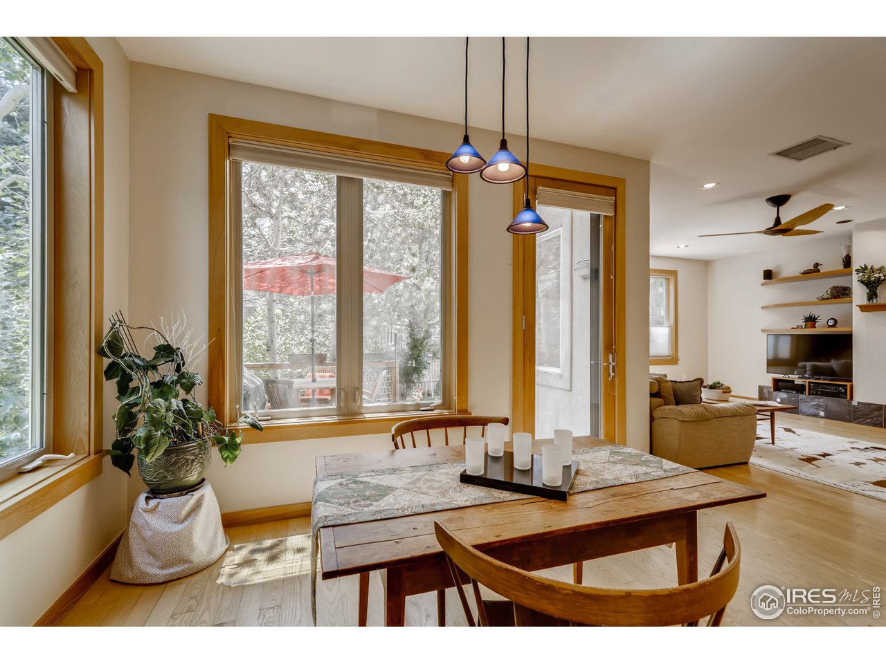 566 Dakota Boulevard Boulder, CO 80304 - Photo 9 of 24 a living room with furniture a window and a chandelier