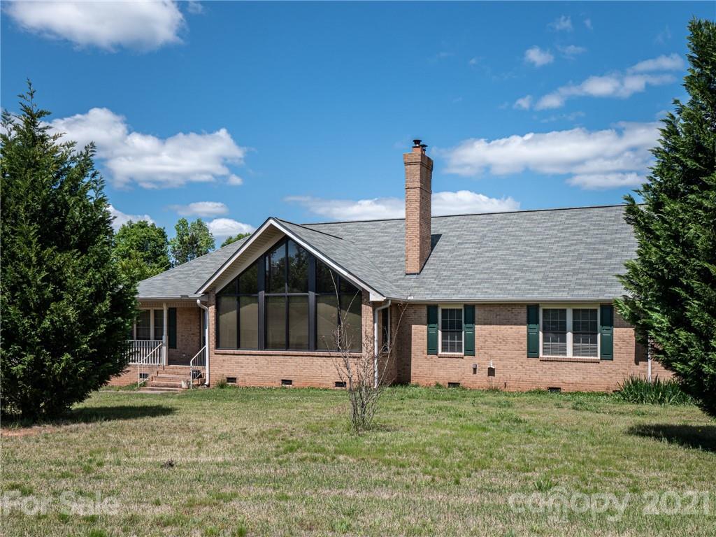 3292 Harmony Road Catawba, SC 29704 - Photo 1 of 20 a front view of a house with a garden