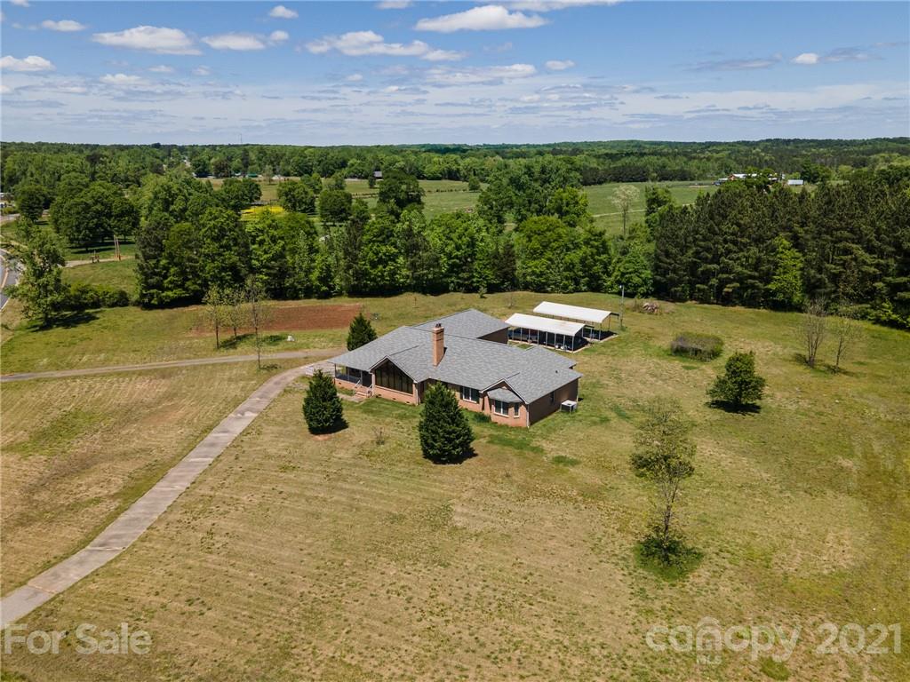 3292 Harmony Road Catawba, SC 29704 - Photo 16 of 20 a view of swimming pool with seating area and green space