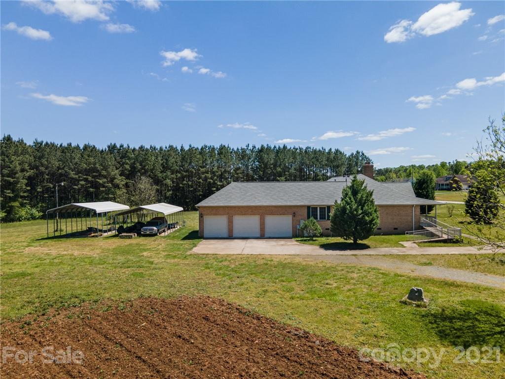 3292 Harmony Road Catawba, SC 29704 - Photo 18 of 20 a view of a swimming pool with an outdoor space and seating area