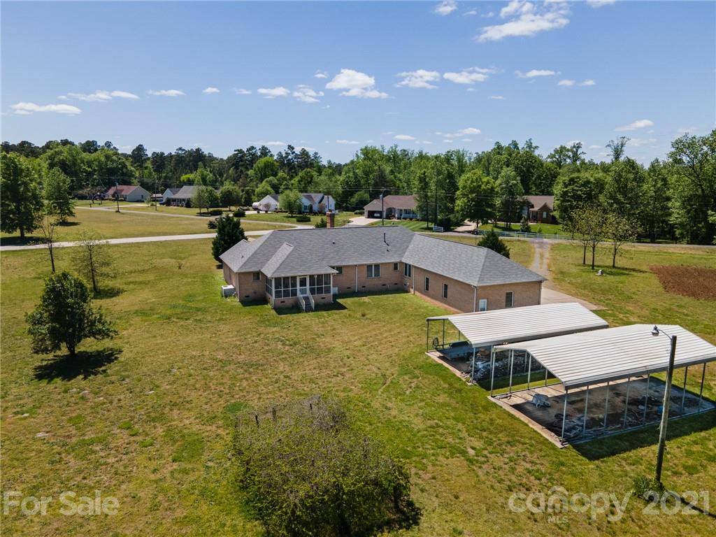 3292 Harmony Road Catawba, SC 29704 - Photo 19 of 20 a swimming pool with outdoor seating and yard