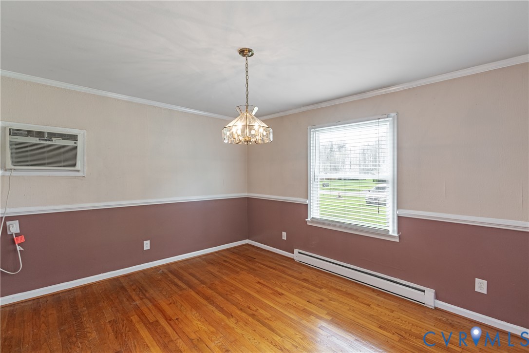 2730 Kinvan Road Henrico, VA 23231 - Photo 15 of 37 Hardwood flooring, decorative chandelier, window w