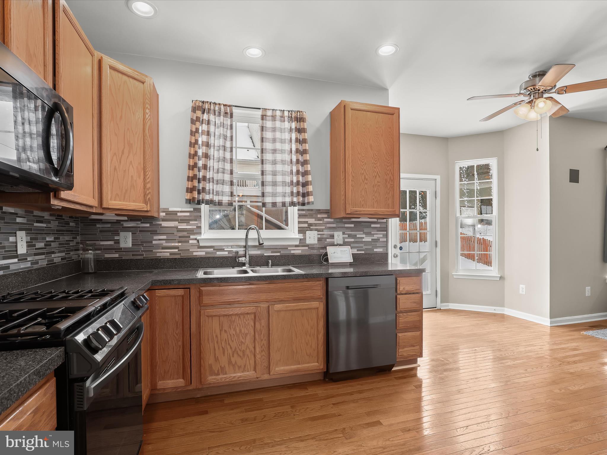 15 Dunmore Drive Hanover, PA 17331 - Photo 15 of 40 a kitchen with stainless steel appliances granite countertop a sink stove and refrigerator
