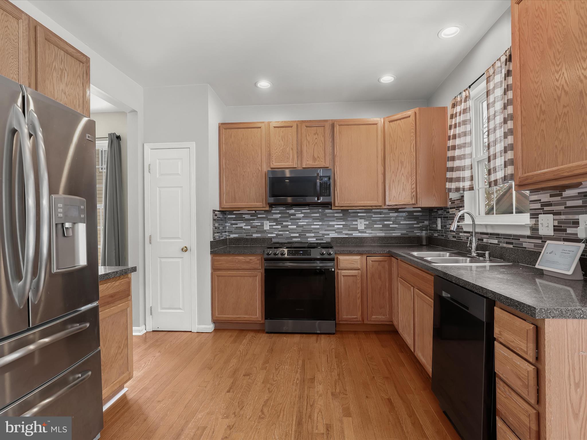 15 Dunmore Drive Hanover, PA 17331 - Photo 16 of 40 a kitchen with stainless steel appliances granite countertop a sink stove and refrigerator