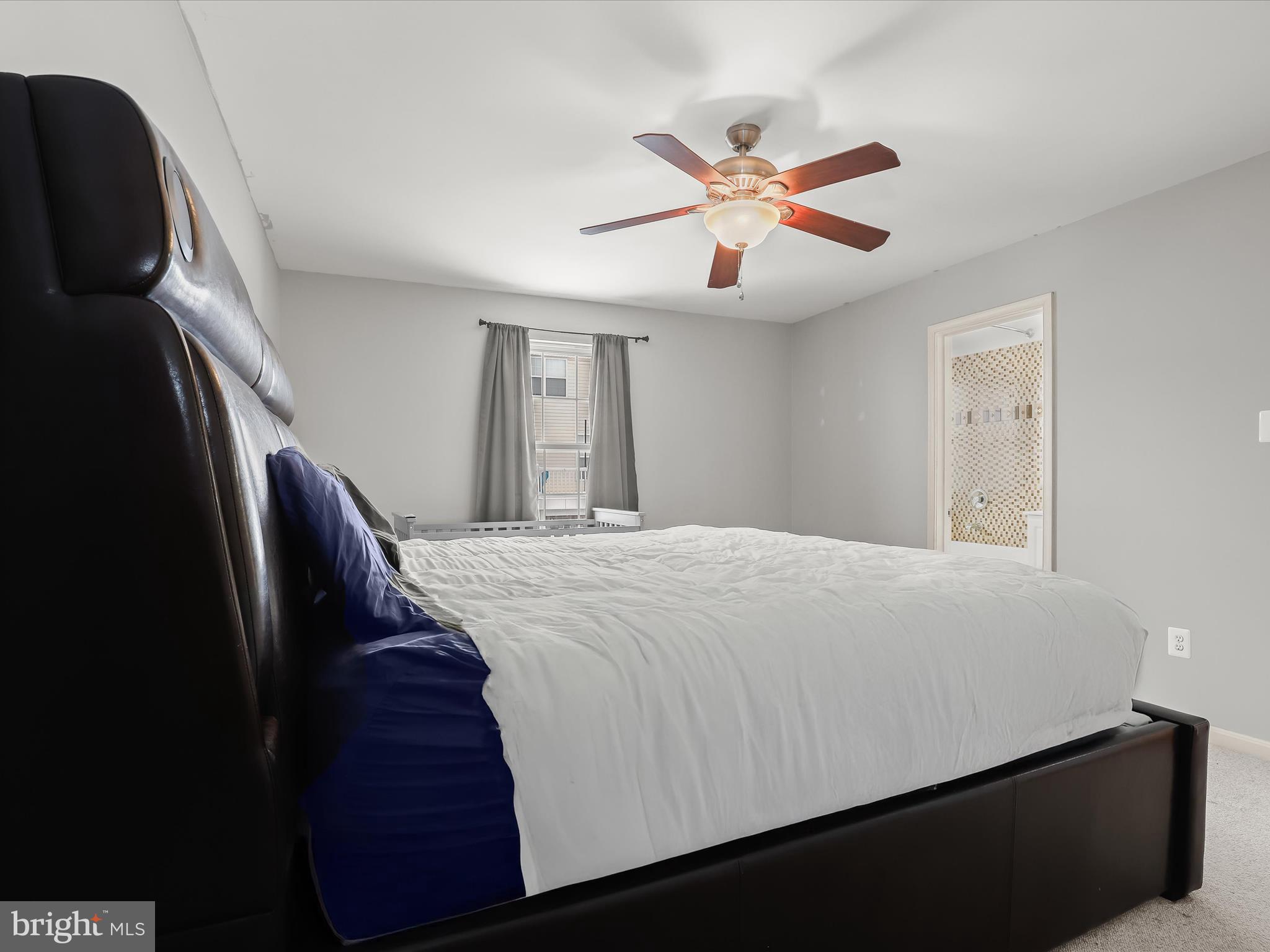 15 Dunmore Drive Hanover, PA 17331 - Photo 22 of 40 a bedroom with a large bed and a chandelier