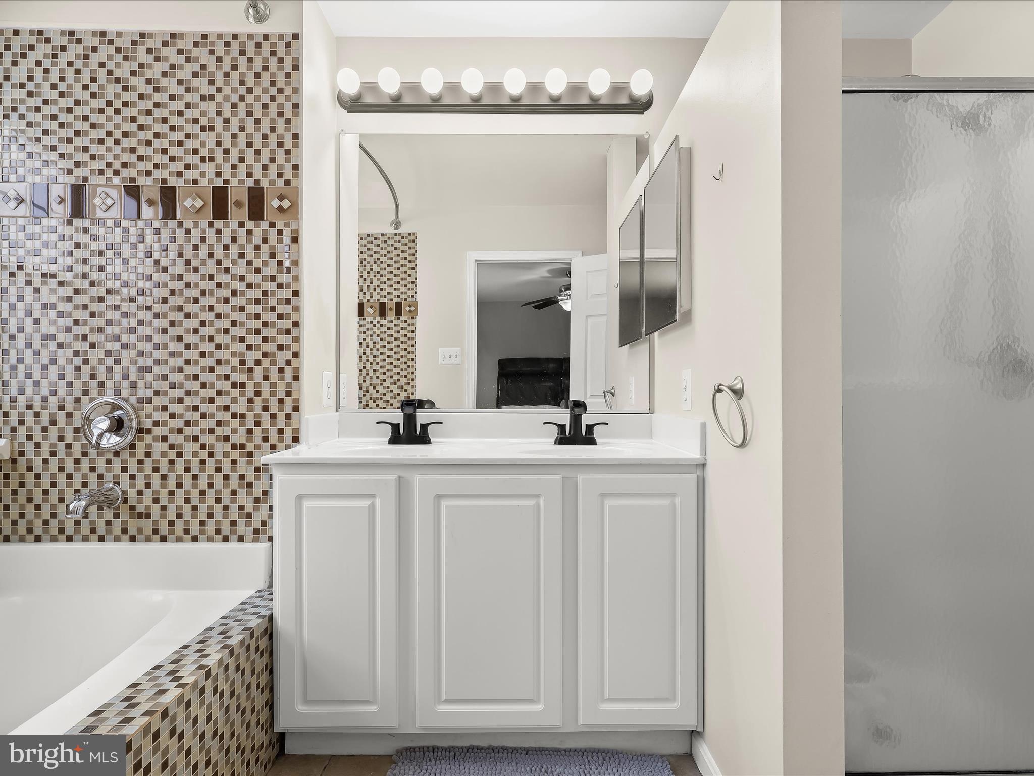 15 Dunmore Drive Hanover, PA 17331 - Photo 23 of 40 a bathroom with a sink a mirror and a bathtub