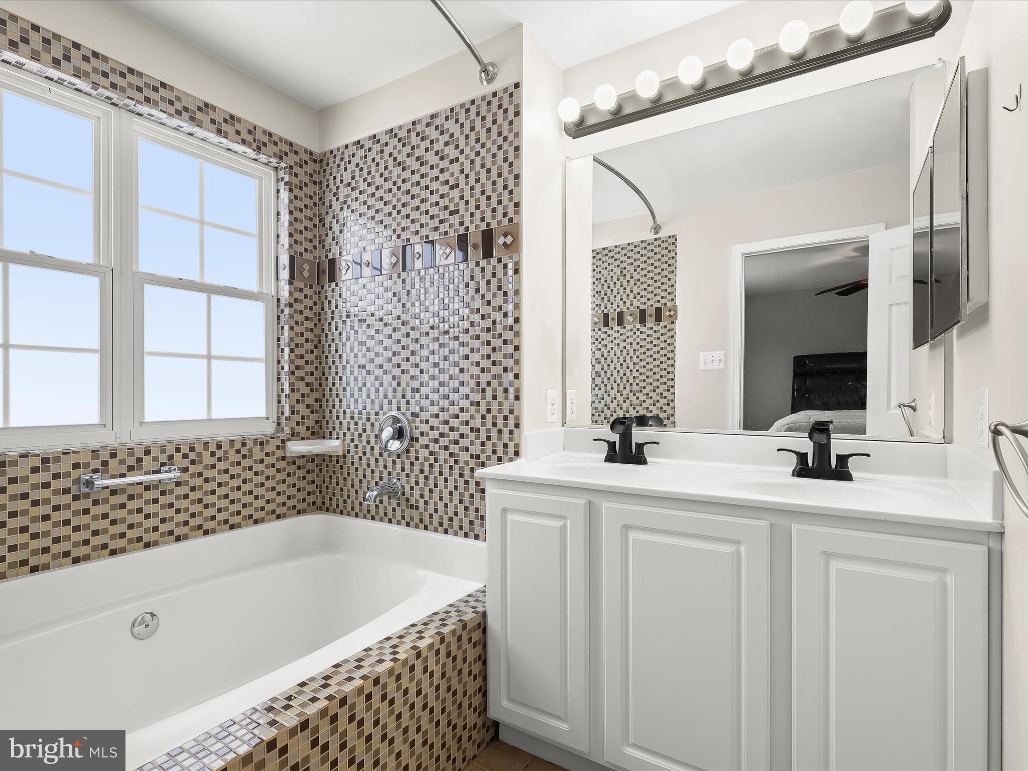 15 Dunmore Drive Hanover, PA 17331 - Photo 24 of 40 a bathroom with a tub sink and mirror