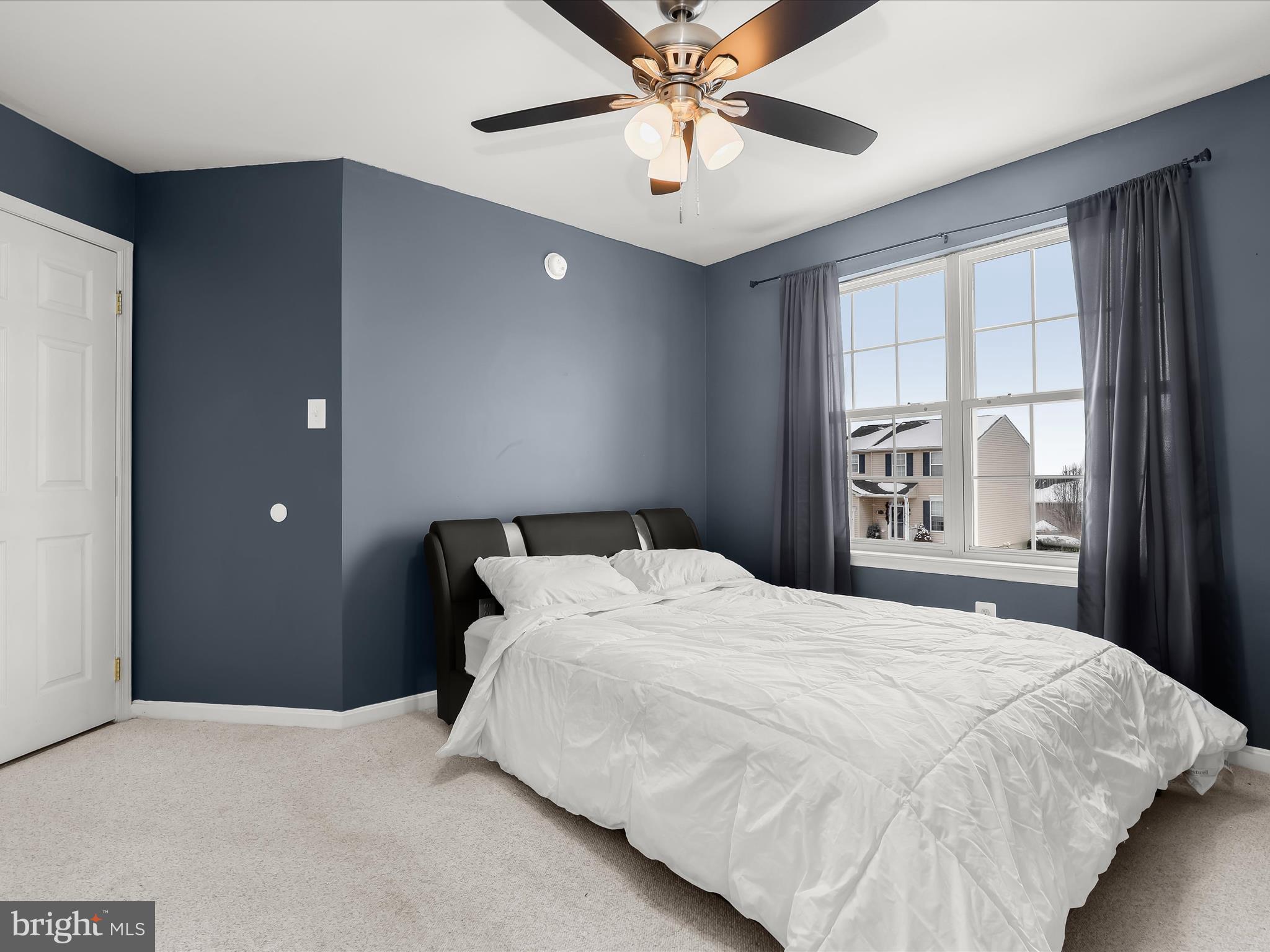 15 Dunmore Drive Hanover, PA 17331 - Photo 28 of 40 a bedroom with a large bed and a chandelier