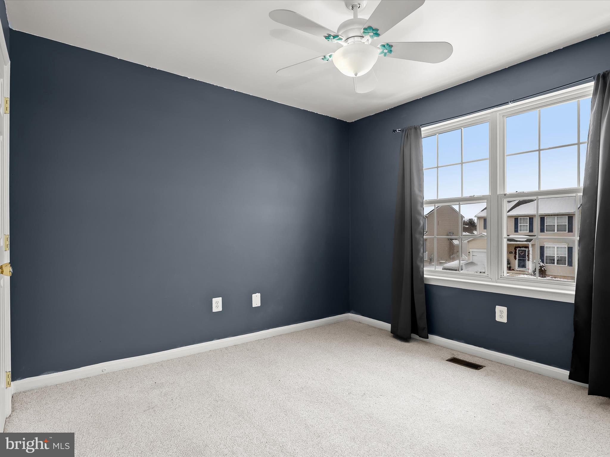 15 Dunmore Drive Hanover, PA 17331 - Photo 31 of 40 an empty room with windows and ceiling fan