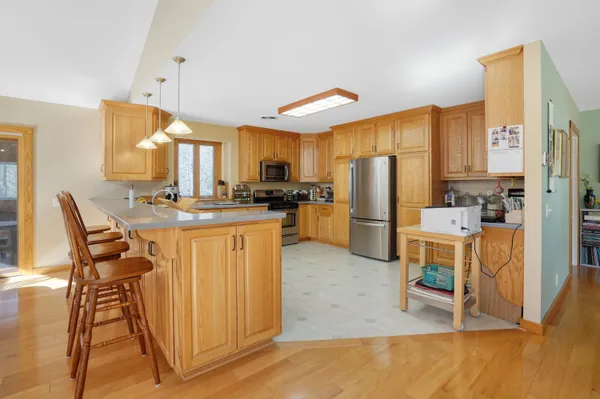 a bedroom with furniture and a large window