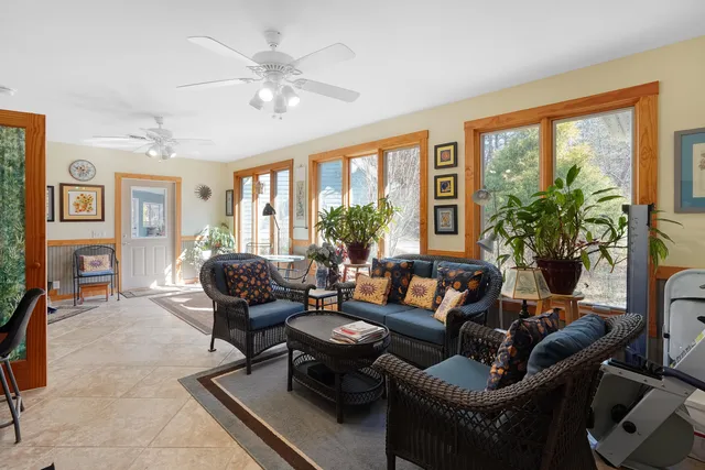 a bathroom with a granite countertop sink mirror vanity and toilet