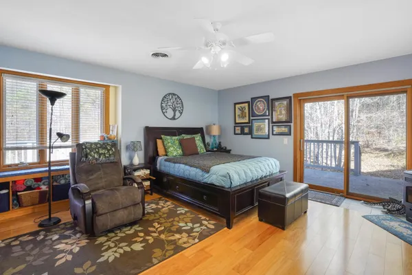 a view of a dining room with furniture wooden floor and a chandelier