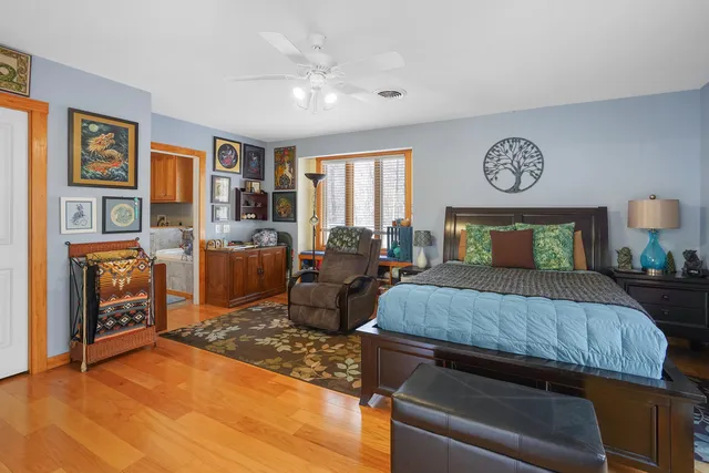 a view of deck with wooden floor and fence next to a large window