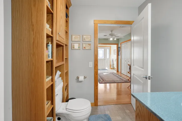 a kitchen with cabinets appliances and a window