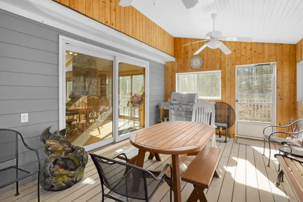 a view of a livingroom with furniture and an empty room