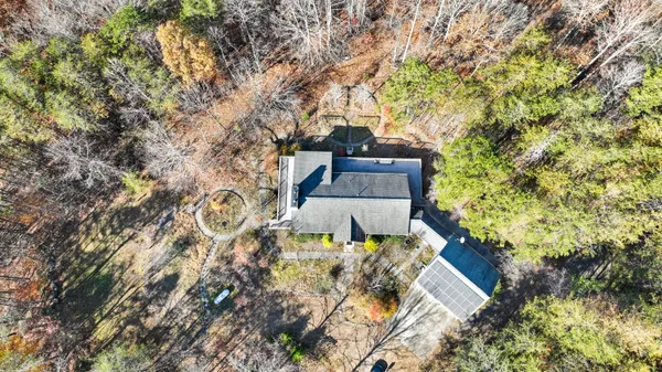 a living room with furniture a fireplace and a chandelier
