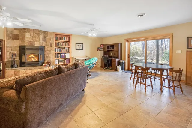 a view of balcony with wooden floor and fence