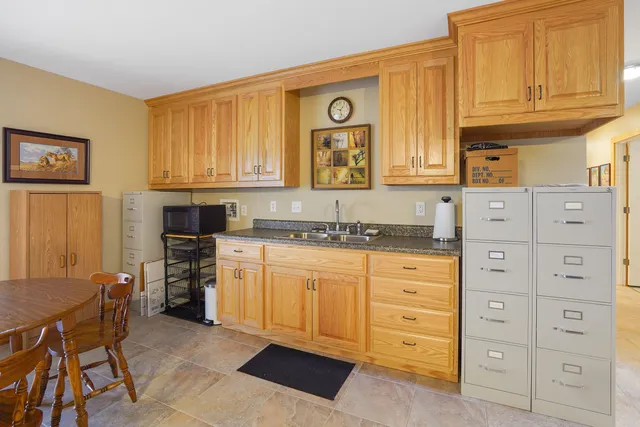 a view of a house with a small yard and plants