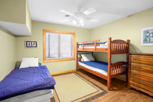 a backyard of a house with lots of green space and a fountain