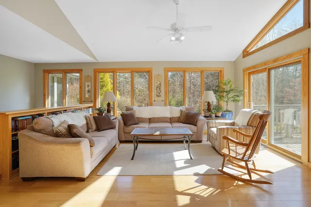 a kitchen with a refrigerator a stove a sink dishwasher with a dining table and chair