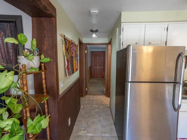 a white refrigerator freezer sitting in a kitchen