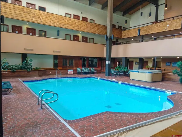 a view of an chairs and tables in the patio