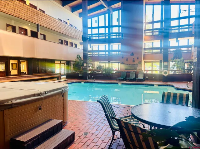 a patio with table and chairs