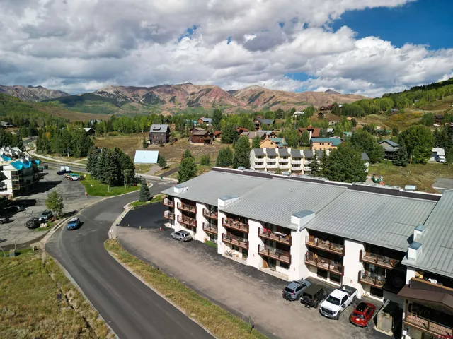 an aerial view of a house with a garden