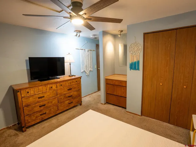 a room with furniture and flat screen tv