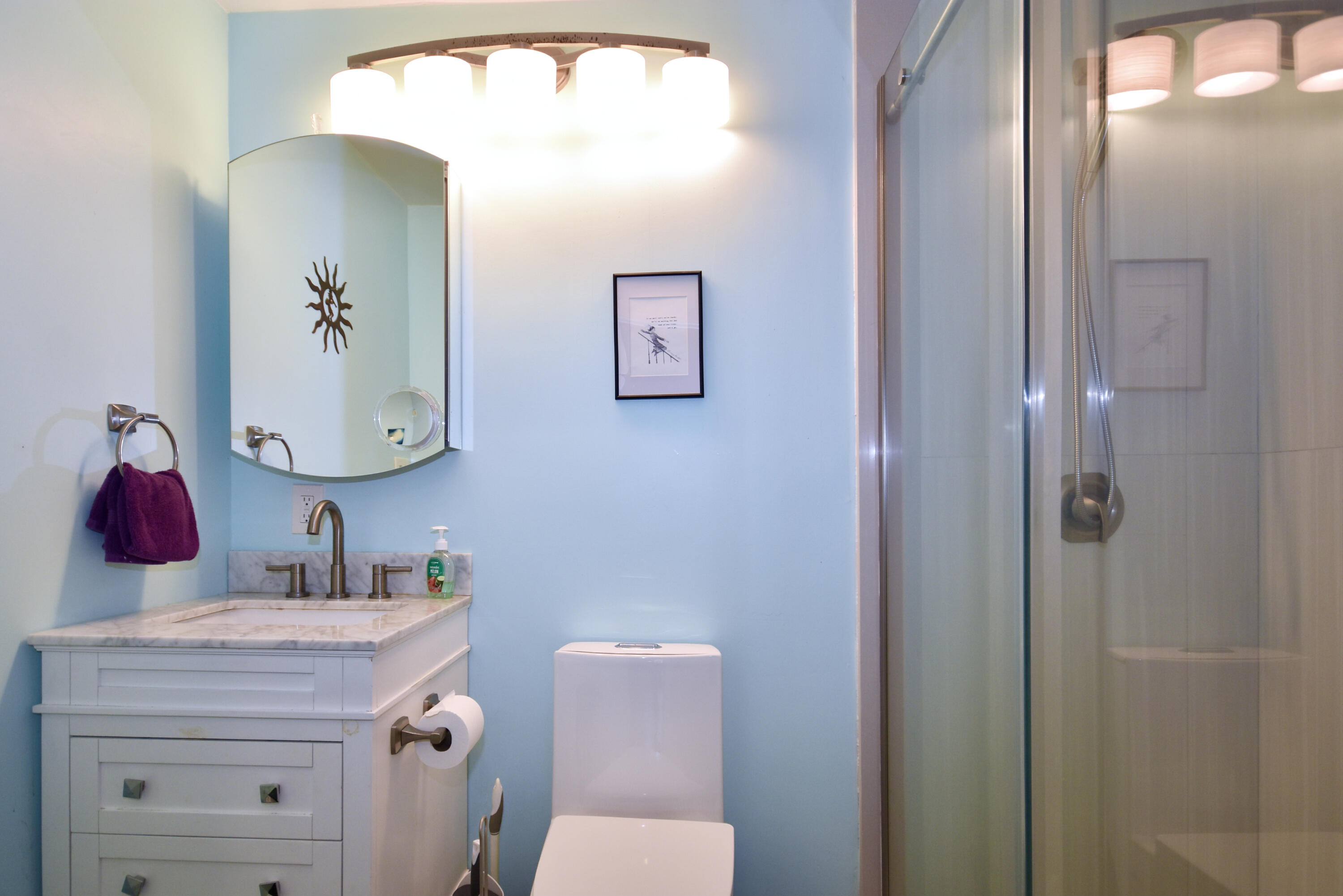 300 Buck Island Road, Unit 5D West Yarmouth, MA 02673 - Photo 14 of 22 a bathroom with a toilet a sink and mirror