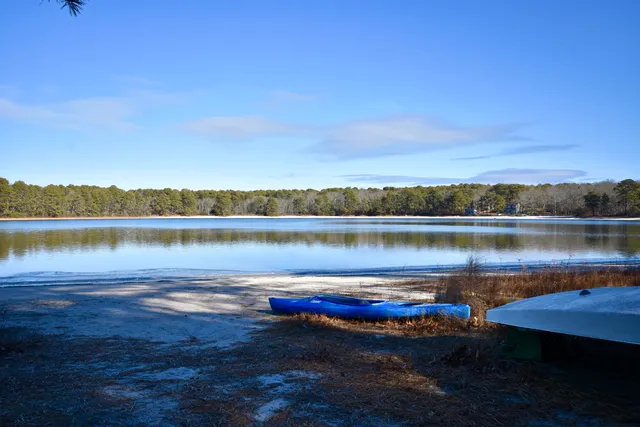 a view of a lake with houses in the back