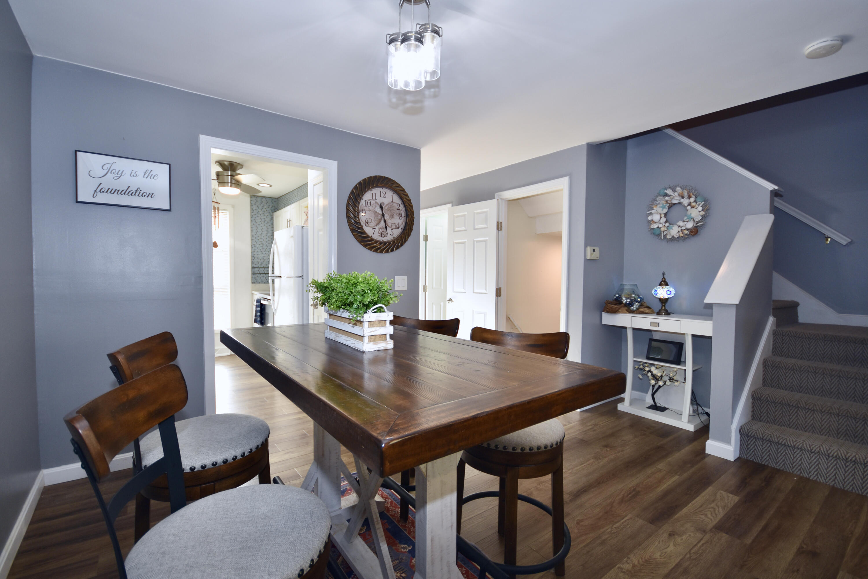 300 Buck Island Road, Unit 5D West Yarmouth, MA 02673 - Photo 6 of 22 a view of a dining room with furniture and wooden floor