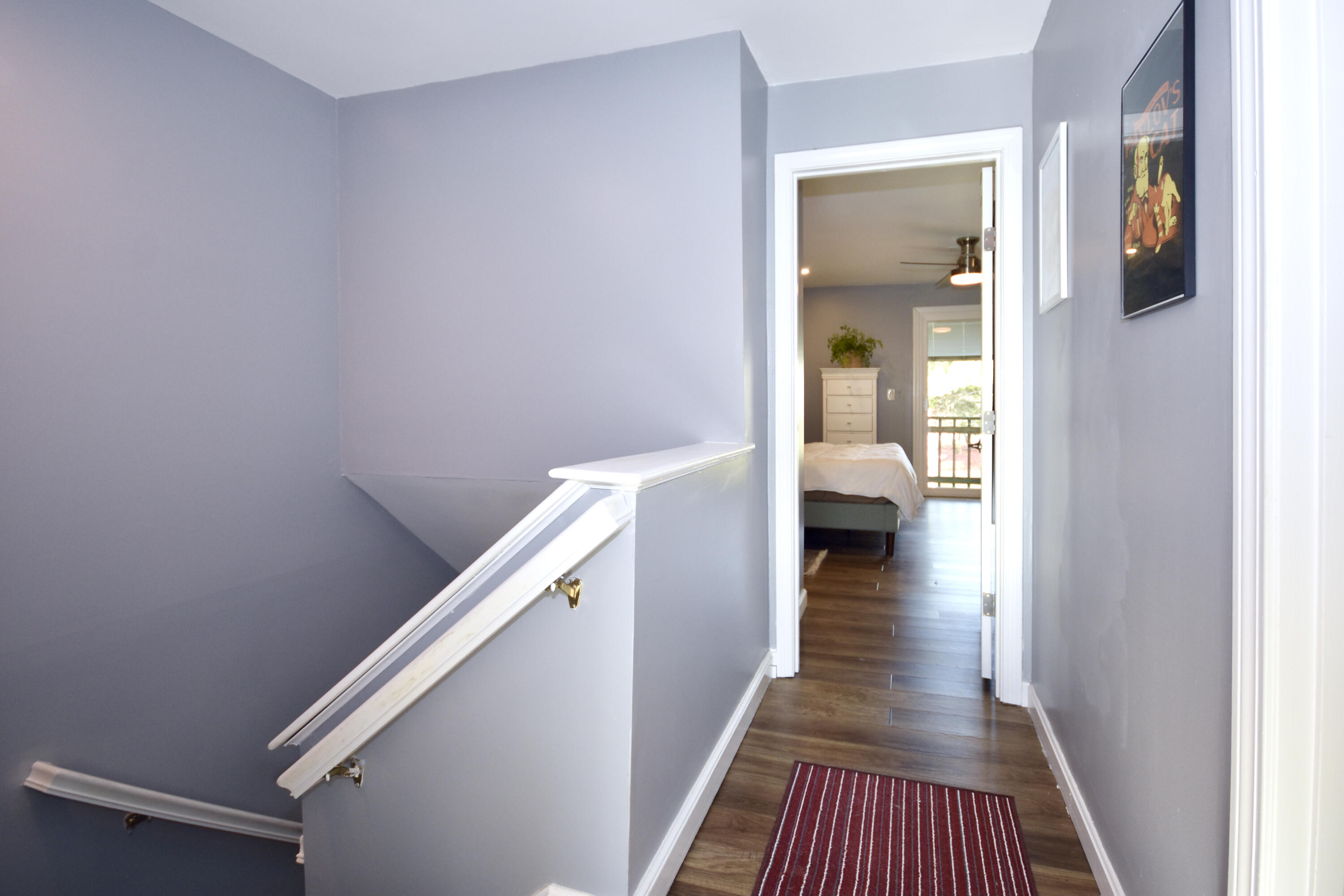 300 Buck Island Road, Unit 5D West Yarmouth, MA 02673 - Photo 10 of 22 a view of a hallway with wooden floor and stairs