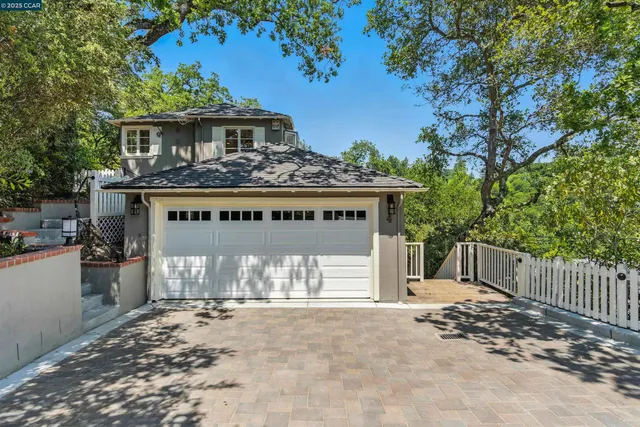 a front view of a house with a garage