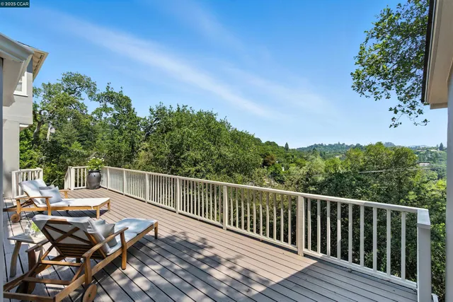 a view of a balcony with furniture