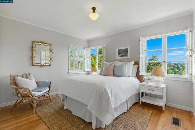 a bedroom with a bed and a couch