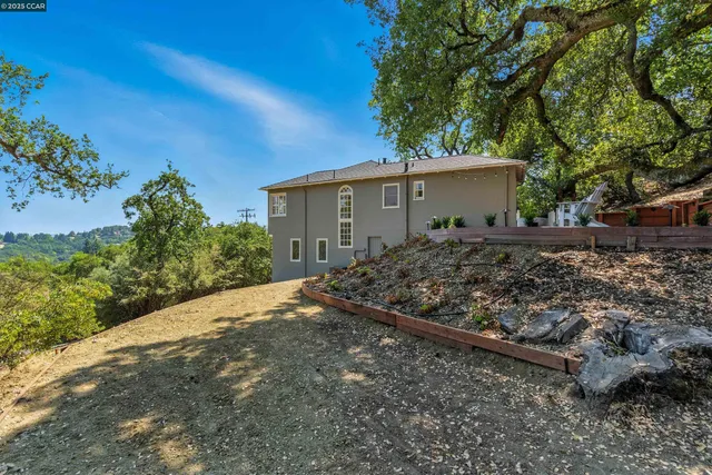 a backyard of a house with lots of green space