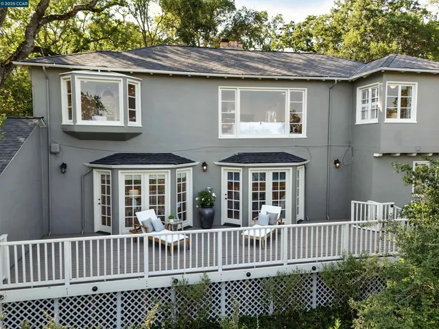 a porch with a bench in front of it