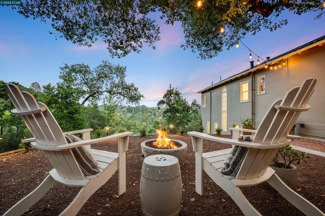 a view of a room with a tree and a yard