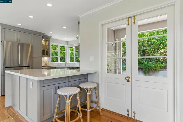 a kitchen with a table and chairs