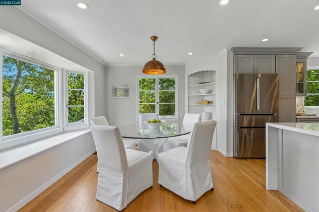 a dining room with furniture a livingroom and chandelier