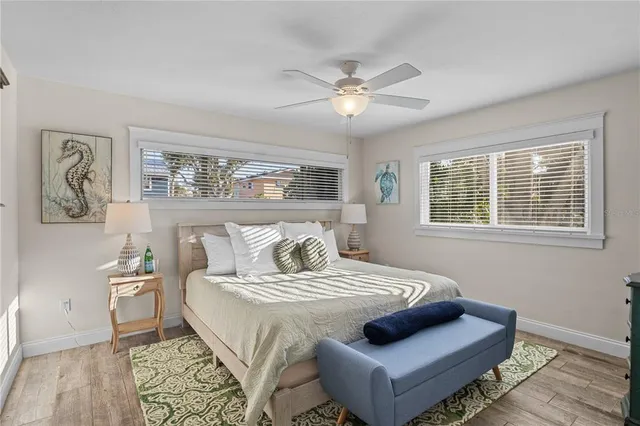 a bedroom with a large bed and a window