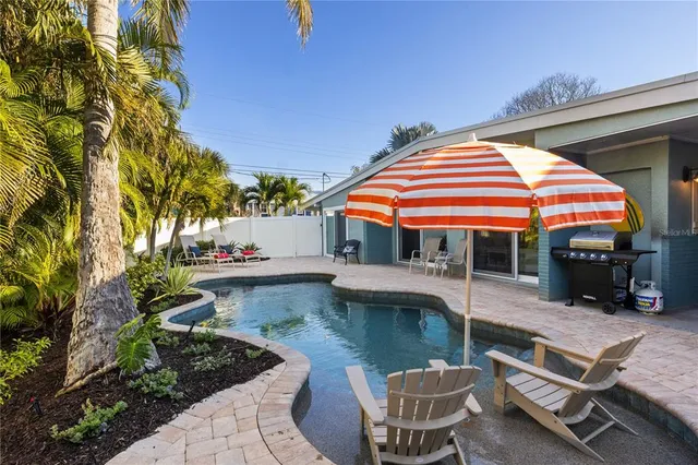 a view of a chairs and table in the patio