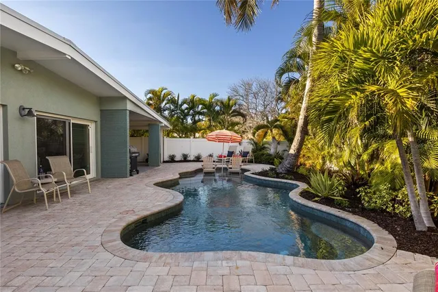 a view of swimming pool with seating space