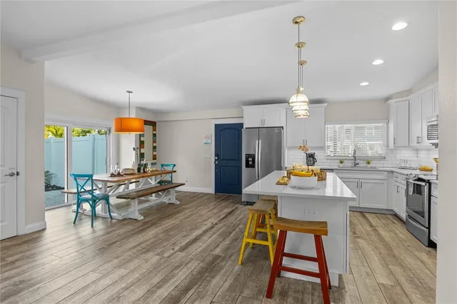 a kitchen view of counter top space and living room