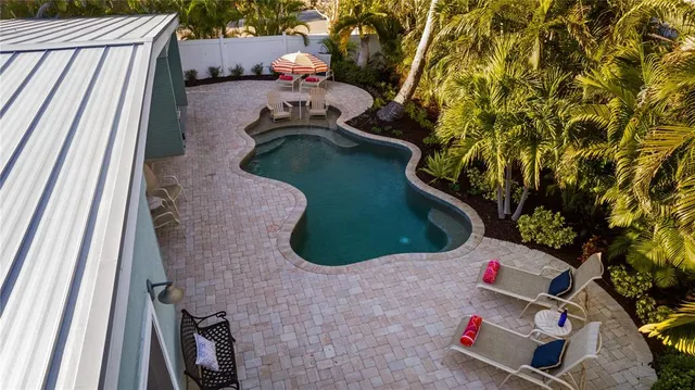 a kitchen with a stove a chair and a table