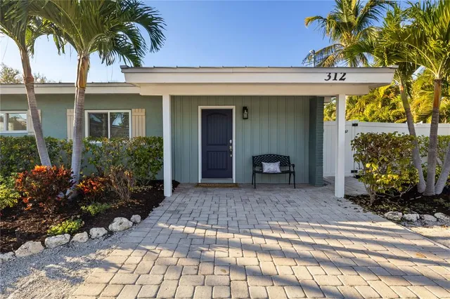 an aerial view of house with yard