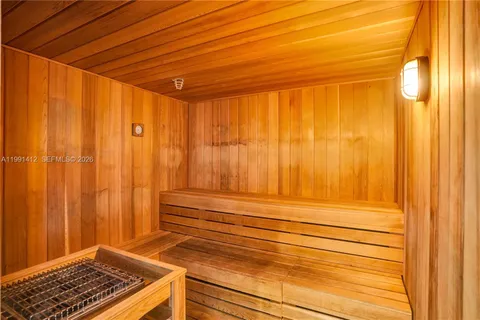 a view of a room with wooden floor and a window