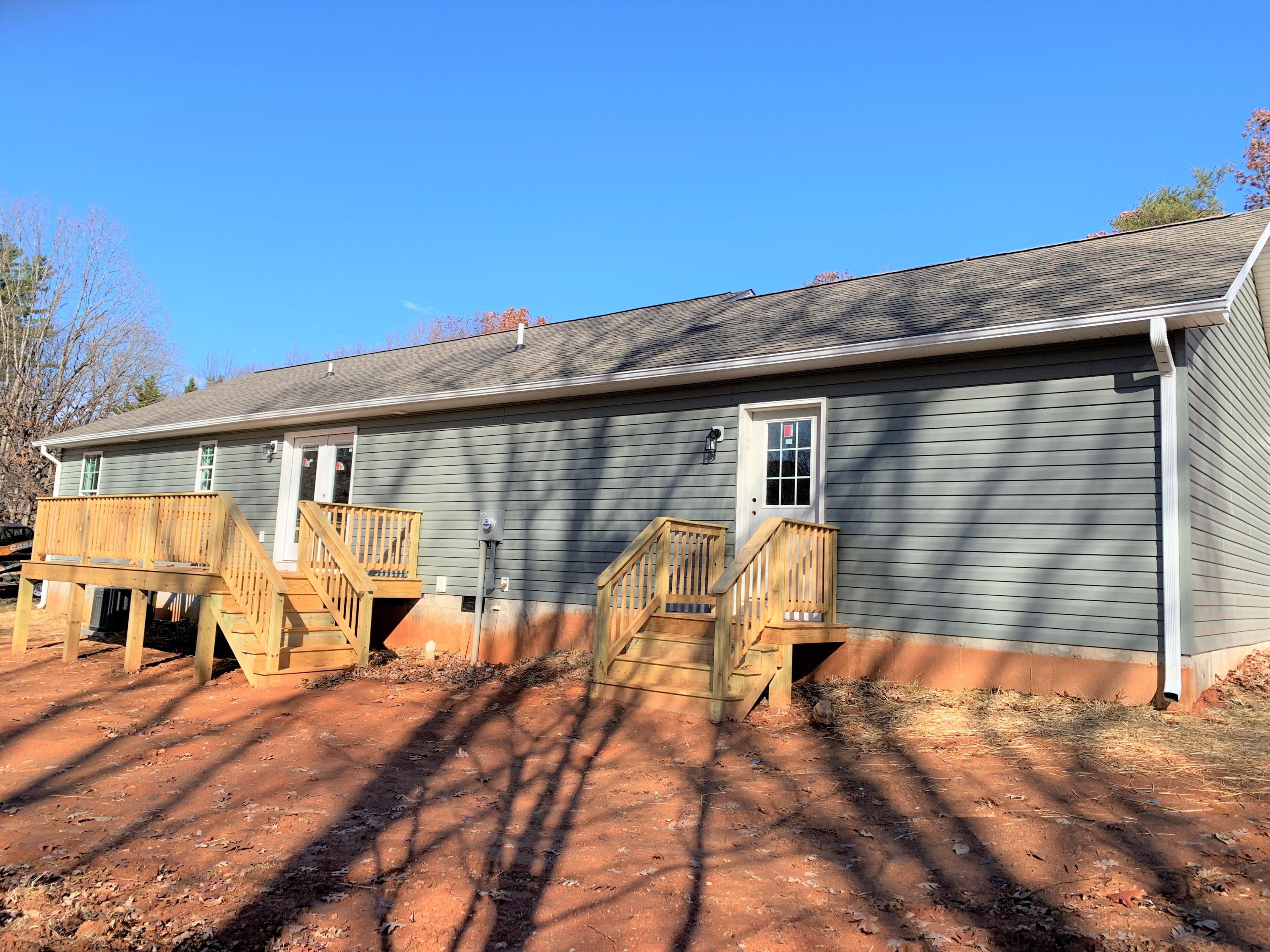2731 Edwardsville Road Hardy, VA 24101 - Photo 19 of 45 a view of a patio with table and chairs with wooden floor and fence